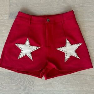 Red suede shorts with white leather stars